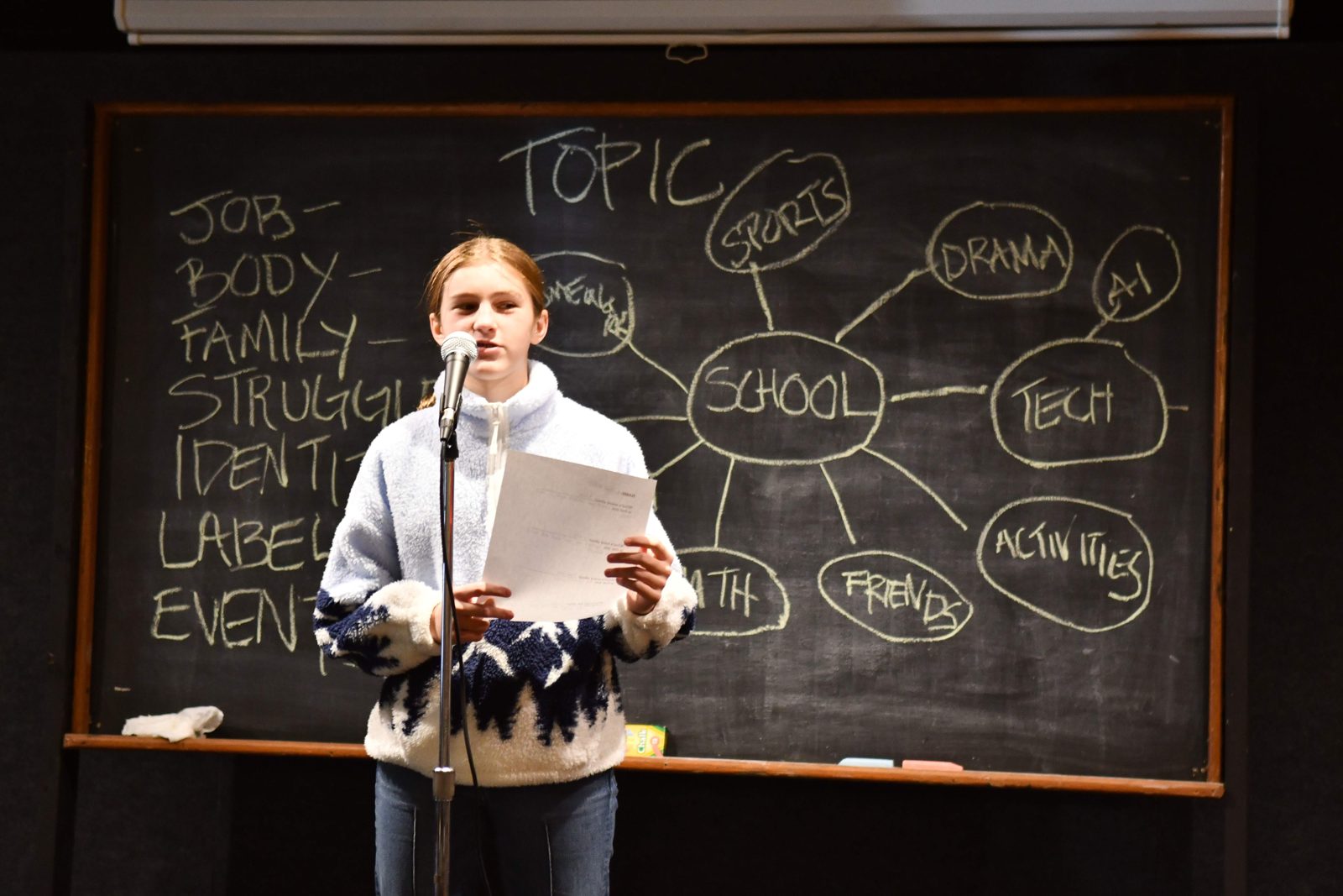 Young comic performing material written in the workshop