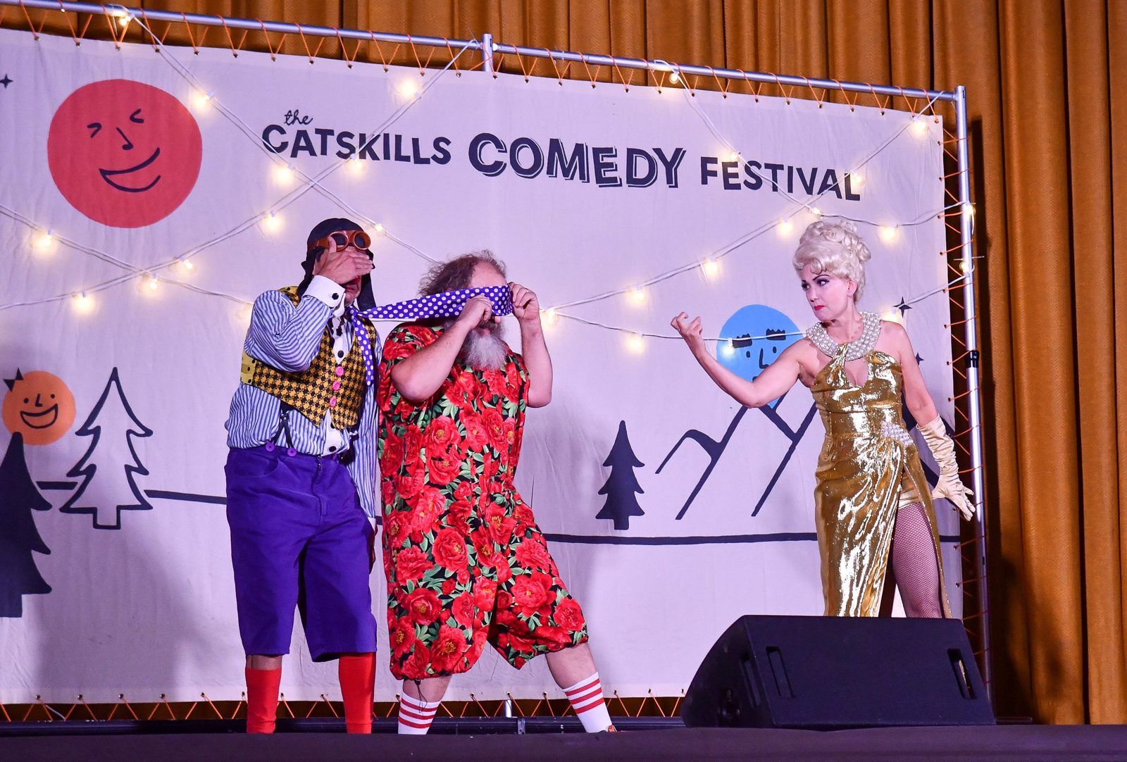 Costumed performers goofing around during the family show